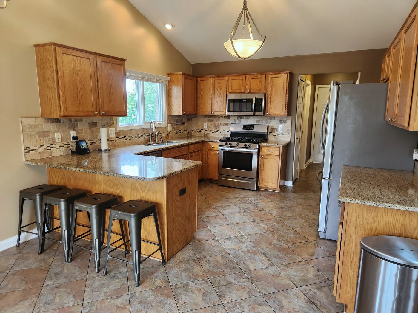 Kitchen with travertine backsplash