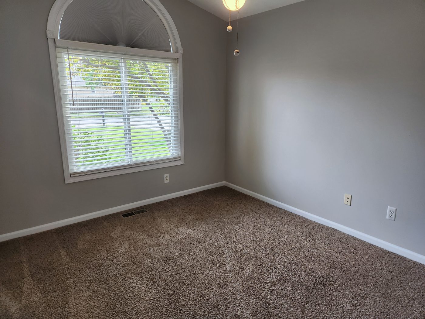Bedroom with arched window
